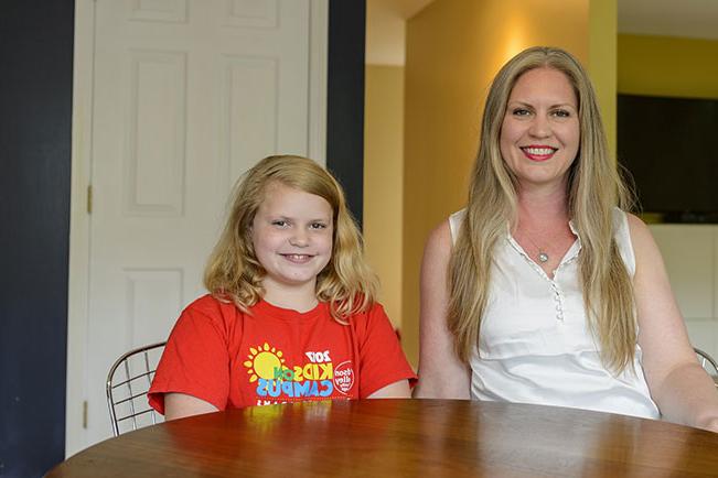 Jenny R. and Millie R. sitting at a table